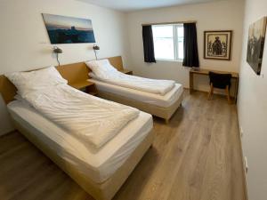 Postel nebo postele na pokoji v ubytování Lambastadir Guesthouse