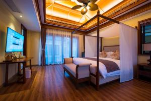 Ένα ή περισσότερα κρεβάτια σε δωμάτιο στο The Sapphire Villa