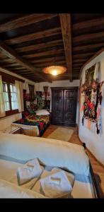 a living room with a bed and a couch at Pensiunea Rustic Oncesti in Onceşti +42 photos