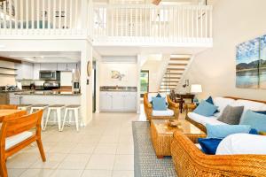 a living room with a couch and a table at Keiki Honu Kauai Princeville 2BR2BA King+Queen bed in Princeville