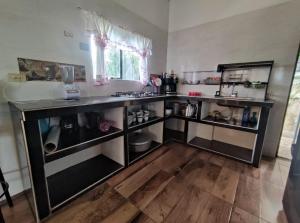 a kitchen with a counter and a sink at Finca cuatro orquídeas in La Mesa