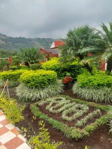 a garden with a peace sign in the dirt at Quinta Rubi in Las Rosas