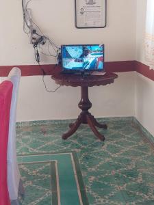 a laptop computer sitting on a table in a room at Quinta Rubi in Las Rosas