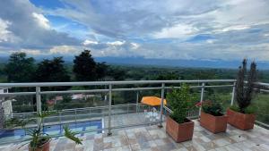 a view from the balcony of a house at Villa Carolina Casa Campestre in Montenegro
