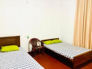 Letto o letti in una camera di Yu Home Stay Anuradhapura