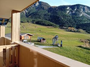 a view from the balcony of a house with mountains at Apartment in Northern Alps near Arc in Val Cenis