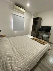 Ένα ή περισσότερα κρεβάτια σε δωμάτιο στο Casa nueva a estrenar