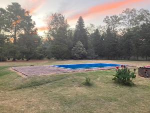 a swimming pool in the middle of a field at Gran Quinta en Mercedes con piscina in Mercedes
