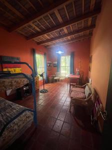 a room with a bedroom with a bed and a table at Gran Quinta en Mercedes con piscina in Mercedes +12 photos