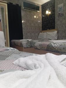 Voodi või voodid majutusasutuse Cairo hotel toas