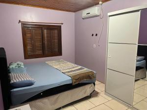 Katil atau katil-katil dalam bilik di Casa dos Thomas- Casa Compartilhada com quartos privativos