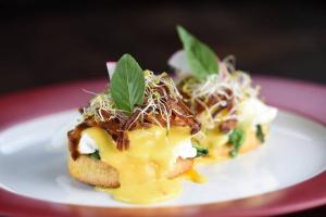 a white plate with a piece of food on it at Villa Toto Seminyak in Seminyak