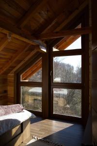 a room with a large window in a cabin at Tara Cozy Home in Mokra Gora +38 photos