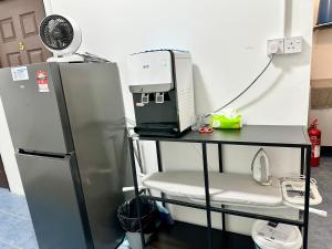 a room with a refrigerator and a table with a printer at Bahari 58 in George Town +40 photos