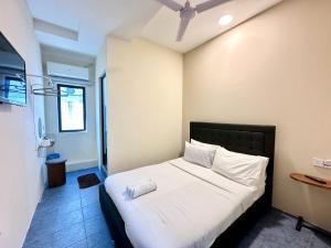 Ένα ή περισσότερα κρεβάτια σε δωμάτιο στο Bahari 58