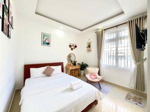Postel nebo postele na pokoji v ubytování My My House Đà Lạt