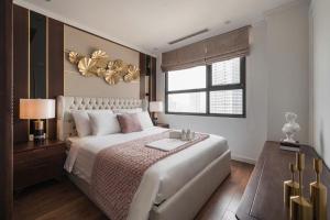 เตียงในห้องที่ D'capital Trần Duy Hưng Homestay