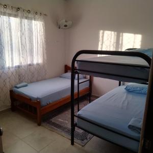 Postel nebo postele na pokoji v ubytování Lis Home