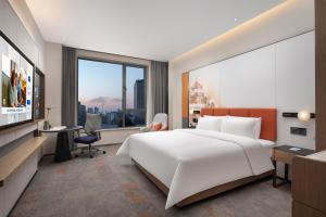 Postel nebo postele na pokoji v ubytování Hampton by Hilton Baoding High-tech Zone