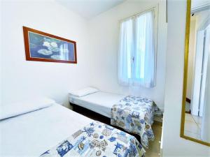 Postel nebo postele na pokoji v ubytování Nice villa in Caorle with balcony