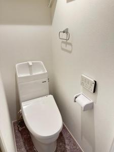 a bathroom with a white toilet in a room at 新大久保から徒歩7分の新しいアパート1 in Tokyo +37 photos