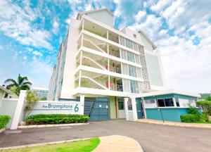 a white building with a sign in front of it at The Soul of Kingston Chic 2BR Condo with Pool and GYM in Kingston