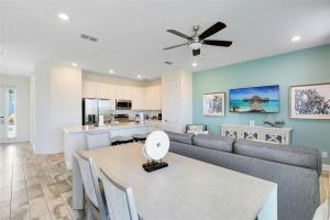 a living room with a couch and a table at Margaritaville Florida Getaway in Orlando