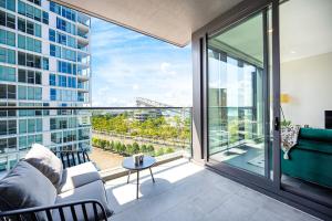 a living room with a view of a city at Lidcombe Apt Near Olympic Park Train in Sydney
