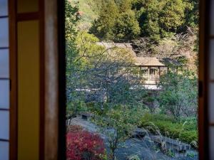 a view of a house from a window at 河辺ふるさとの宿 in Ōzu