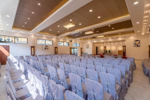 a large room with rows of chairs in it at Triple Crown Resort in Dhāding +79 photos