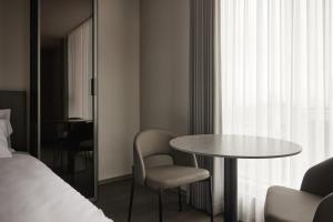 Krevet ili kreveti u jedinici u okviru objekta Homes Stay Myeongdong