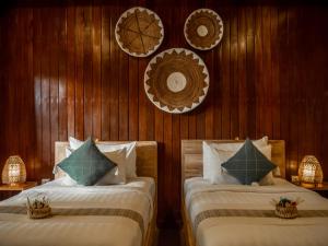 Postel nebo postele na pokoji v ubytování Tattva Ubud Retreat & Wellness + 37 fotografií