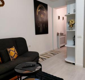 a living room with a couch and a table at Studio in Tulcea