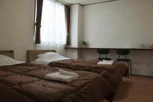 Katil atau katil-katil dalam bilik di Crafthotel 西町Dock
