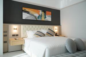 Ένα ή περισσότερα κρεβάτια σε δωμάτιο στο Amarah Hotel