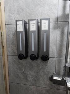 a group of three wii controllers on a wall at AREX Hongik univ Unit 201 in Seoul +27 photos