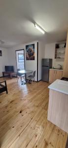 an empty room with a table and a kitchen at Fourways in Four Ways +1 photo