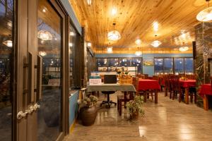 a restaurant with a table and chairs in a room at Mường Hoa Hillside Homestay in Sa Pa +149 photos