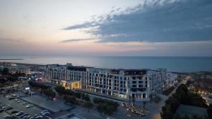 an aerial view of a city with the ocean at Luxury Seaside Stay - SeaBreeze The Grand in Nardaran