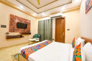 Postel nebo postele na pokoji v ubytování FabHotel Vibe