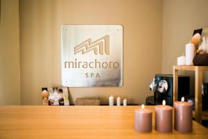 a sign for the micheterota spa with candles on a table at Mirachoro Carvoeiro in Carvoeiro