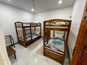 Postel nebo postele na pokoji v ubytování Sigiri Village Vibe Hostel