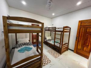 Postel nebo postele na pokoji v ubytování Sigiri Village Vibe Hostel + 20 fotografií