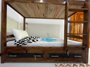 Postel nebo postele na pokoji v ubytování Sigiri Village Vibe Hostel