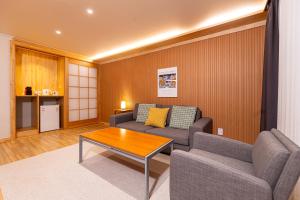 a living room with a couch and a coffee table at Nine Valley Park in Boeun
