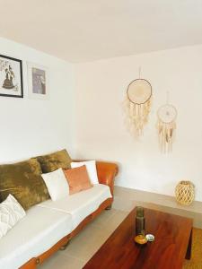 a living room with a couch and a coffee table at Casa Luna in Tolox