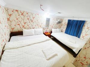 Postel nebo postele na pokoji v ubytování Seaview Guesthouse