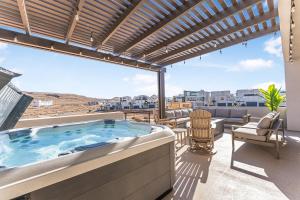 a hot tub on the balcony of a house at Slickrock Shore townhouse in St. George