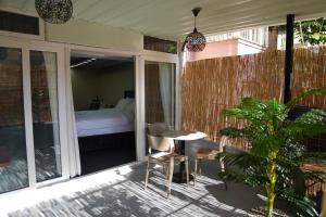 a room with a bed and a table on a balcony at New Hotel Harbiye in Istanbul