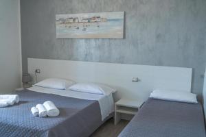 Postel nebo postele na pokoji v ubytování B&B Benvenuti al Sud